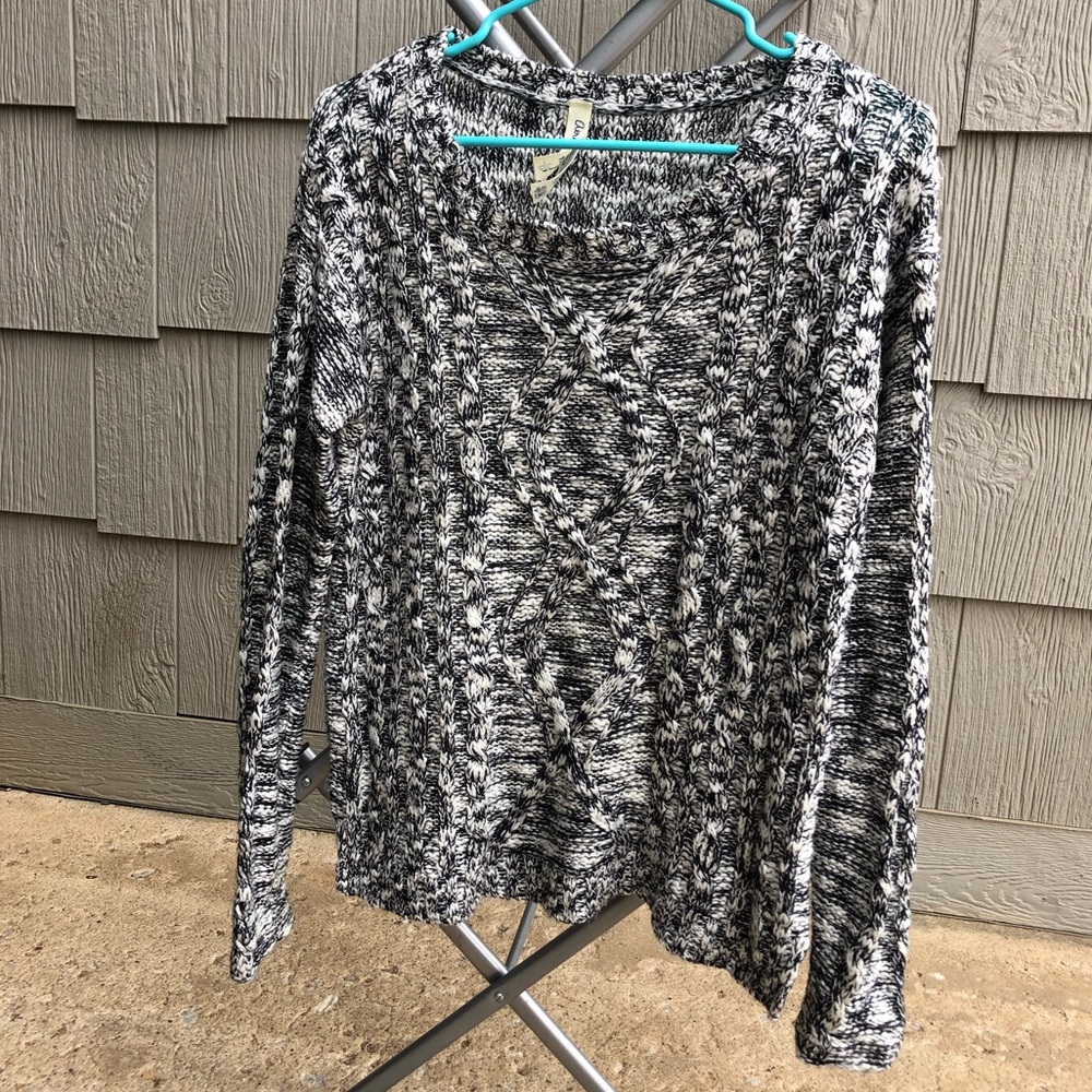 Black and white speckled cable knit sweater